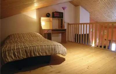 Un ou plusieurs lits dans un hébergement de l'établissement Nice Home In St Maixent Sur Vie