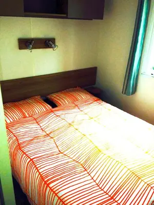 Un ou plusieurs lits dans un hébergement de l'établissement Mobile home