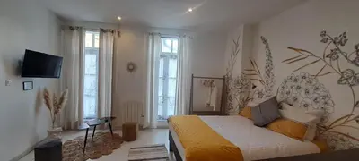 Télévision ou salle de divertissement dans l'établissement Les arcades Studio Coeur de ville
