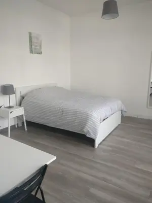 Un ou plusieurs lits dans un hébergement de l'établissement Appart Hôtel L'Angélique