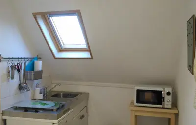 Cuisine ou kitchenette dans l'établissement Mon Petit Studio Sous les Toits