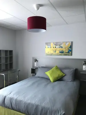 Un ou plusieurs lits dans un hébergement de l'établissement SmartAppart Saint Nazaire