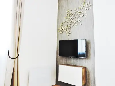 Télévision ou salle de divertissement dans l'établissement F2 Golden Lounge, Hyper Centre, Parking