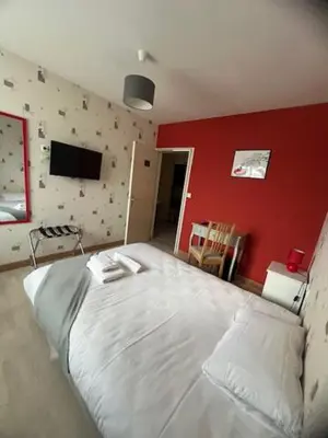 Un ou plusieurs lits dans un hébergement de l'établissement Hotel Le Cormier 9