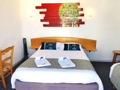 Un ou plusieurs lits dans un hébergement de l'établissement Hotel La Bosselle