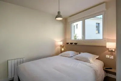 Un ou plusieurs lits dans un hébergement de l'établissement Le Baron Centre - Garage privé - Wifi fibre - classé 3 étoiles