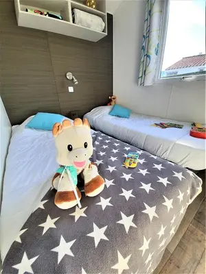 Un ou plusieurs lits dans un hébergement de l'établissement Camping la Plage