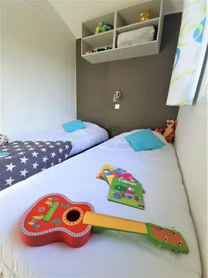 Un ou plusieurs lits dans un hébergement de l'établissement Camping la Plage