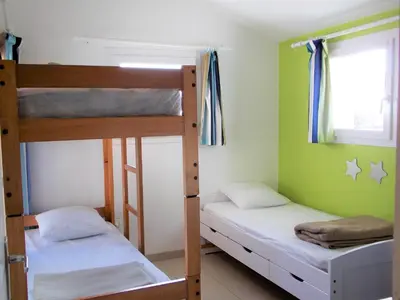 Un ou plusieurs lits dans un hébergement de l'établissement Camping Insolite Le Haut Village
