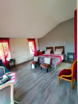 Un ou plusieurs lits dans un hébergement de l'établissement Chambre d'Hôtes du Bois Joli