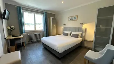 Un ou plusieurs lits dans un hébergement de l'établissement Hotel Le Goeland