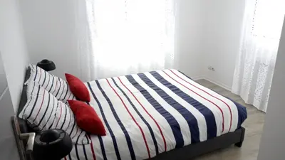 Un ou plusieurs lits dans un hébergement de l'établissement Gîte Club House 2 & 3 Gîte CARQUEFOU Centre