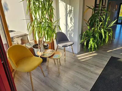Coin salon dans l'établissement Domaine du Bocage