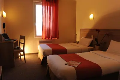 Un ou plusieurs lits dans un hébergement de l'établissement Hotel Salea