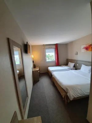 Un ou plusieurs lits dans un hébergement de l'établissement Hotel Salea