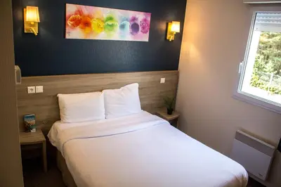 Un ou plusieurs lits dans un hébergement de l'établissement Hotel Salea