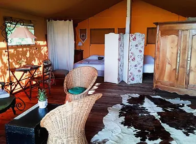 Un ou plusieurs lits dans un hébergement de l'établissement Le Lodge de Loge & Broc