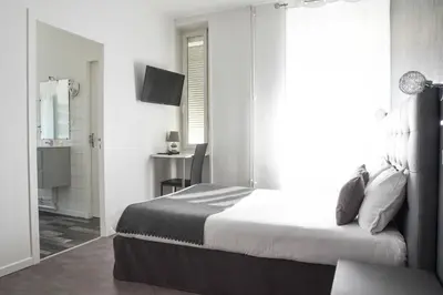 Un ou plusieurs lits dans un hébergement de l'établissement Cit'Hôtel l'Europe - Cholet Gare