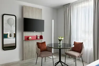 Télévision ou salle de divertissement dans l'établissement Citadines Confluent Nantes