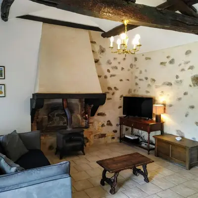Coin salon dans l'établissement Charming Courtyard cottage 25kms Puy du Fou