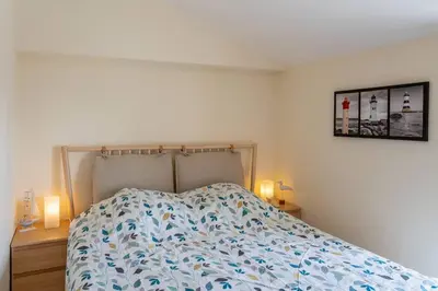 Un ou plusieurs lits dans un hébergement de l'établissement Gîtes Le Bois Berranger