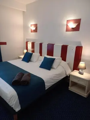 Un ou plusieurs lits dans un hébergement de l'établissement Hôtel Le Centre