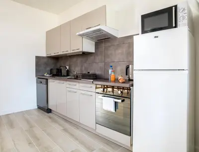 Cuisine ou kitchenette dans l'établissement Résid'Spa Loire & Sèvre