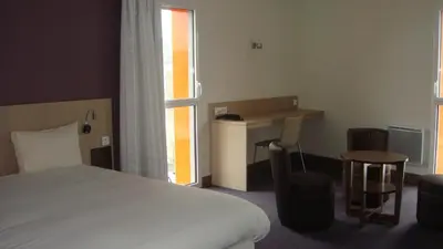Un ou plusieurs lits dans un hébergement de l'établissement The Originals Access, Hôtel Cholet Gare