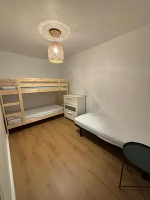 Un ou plusieurs lits dans un hébergement de l'établissement Cottages des Pins