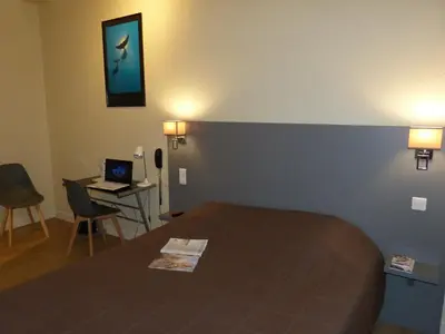 Un ou plusieurs lits dans un hébergement de l'établissement Hôtel Terminus