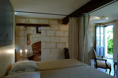 Un ou plusieurs lits dans un hébergement de l'établissement Chambres d'Hôtes Le Clos des 3 Rois