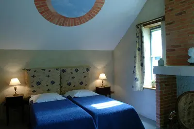 Un ou plusieurs lits dans un hébergement de l'établissement Chambres d'Hôtes Le Clos des 3 Rois