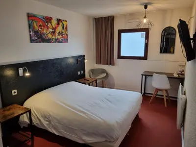 Un ou plusieurs lits dans un hébergement de l'établissement Bel Hotel