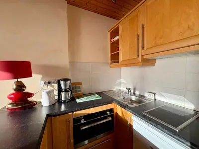 Cuisine ou kitchenette dans l'établissement Appartement 1 chambre, 4 pers, parking privé, face mer, école de voile - FR-1-323-103