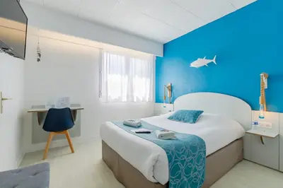Un ou plusieurs lits dans un hébergement de l'établissement Hotel La Cote Oceane - Saint Jean de Monts