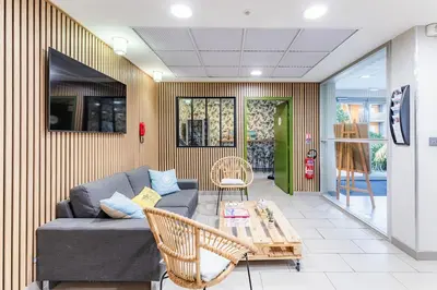 Télévision ou salle de divertissement dans l'établissement Appart'City Confort Saint-Nazaire Océan
