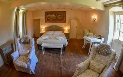 Un ou plusieurs lits dans un hébergement de l'établissement Château de la Grand'cour