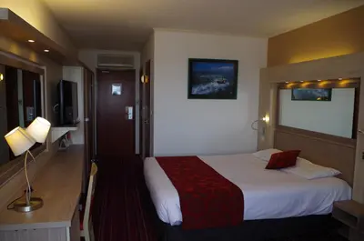 Un ou plusieurs lits dans un hébergement de l'établissement Logis Hotels, Hôtel Aquilon, Saint-Nazaire