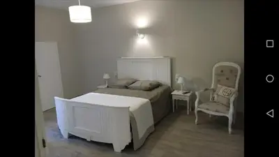 Un ou plusieurs lits dans un hébergement de l'établissement GITE IZALIN AVEC SPA A 20 min du Puy du Fou