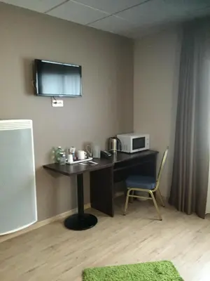 Télévision ou salle de divertissement dans l'établissement Hôtel Particulier VILLA DES MARAIS