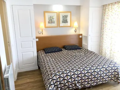Un ou plusieurs lits dans un hébergement de l'établissement Appartement cosy à Saint-André-des-Eaux de 47 m² avec jardin