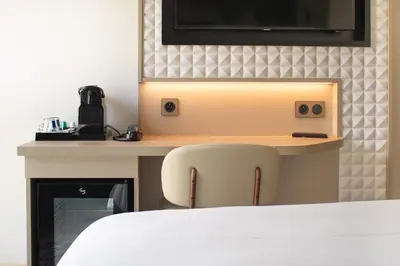 Un ou plusieurs lits dans un hébergement de l'établissement Brit Hotel Nantes Vigneux - L'Atlantel