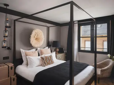 Un ou plusieurs lits dans un hébergement de l'établissement Maisons du Monde Hotel & Suites - Nantes