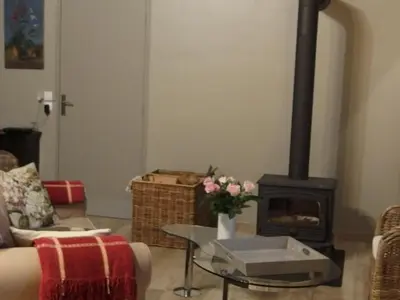 Coin salon dans l'établissement Au calme dans la campagne du Haut Anjou
