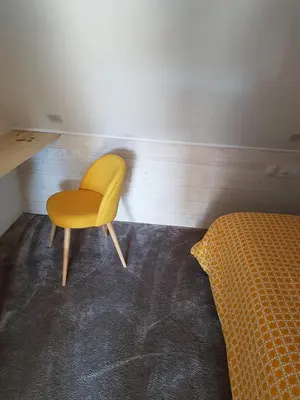 Coin salon dans l'établissement Angers Green Lodge - Yellow Sun Appartement