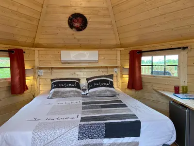 Un ou plusieurs lits dans un hébergement de l'établissement Le Petit Moulin