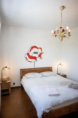 Un ou plusieurs lits dans un hébergement de l'établissement Aux coquelicots sauvages
