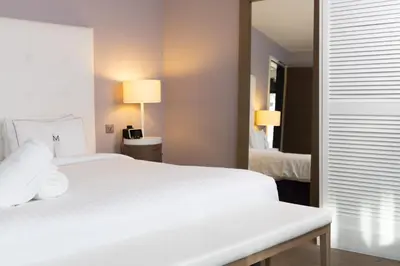 Un ou plusieurs lits dans un hébergement de l'établissement Hôtel Château des Tourelles - Relais Thalasso & Spa