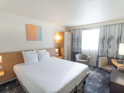 Un ou plusieurs lits dans un hébergement de l'établissement Novotel Nantes Centre Bord de Loire