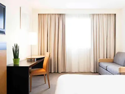 Un ou plusieurs lits dans un hébergement de l'établissement Novotel Nantes Centre Bord de Loire